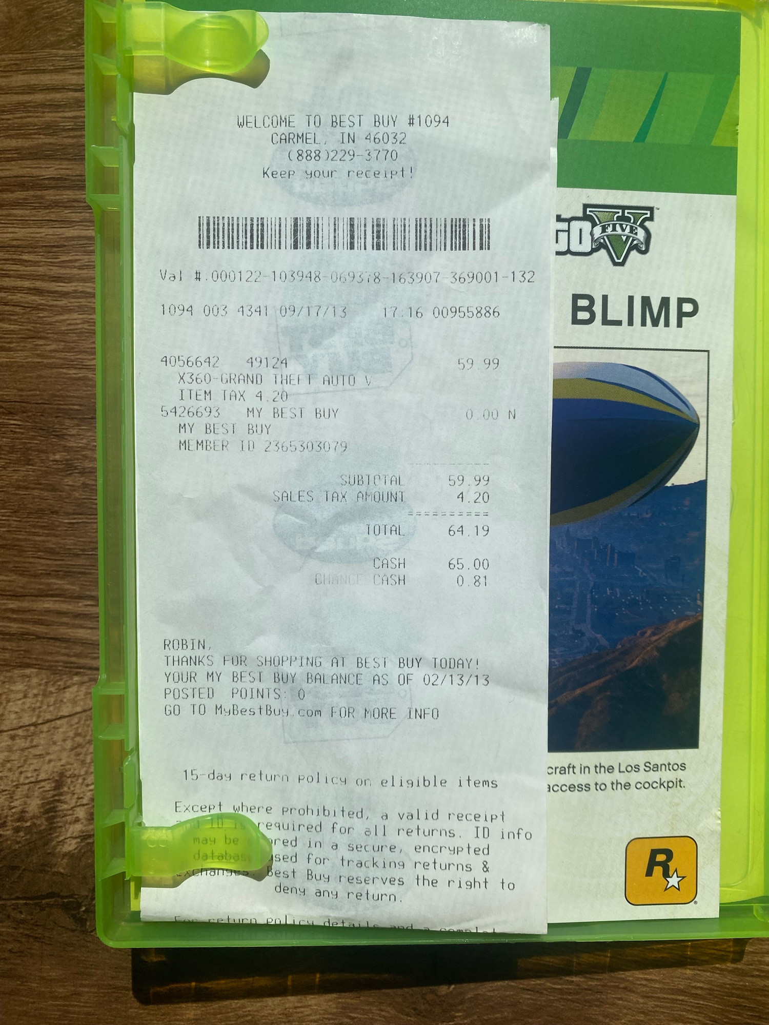 Inside an Xbox 360 case is a receipt from Best Buy for GTA V bought 9/17/13