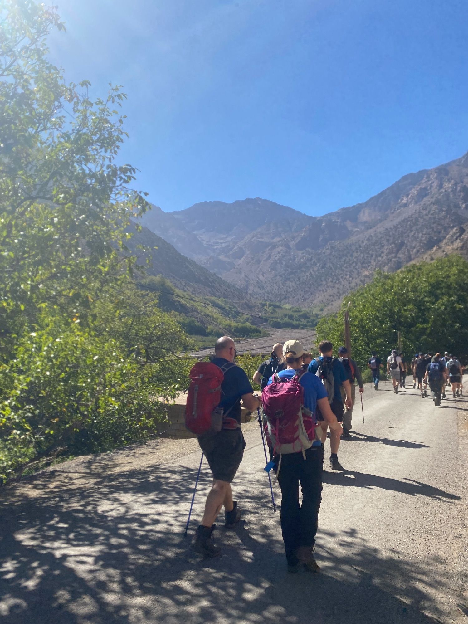 tourists walking up a mountain