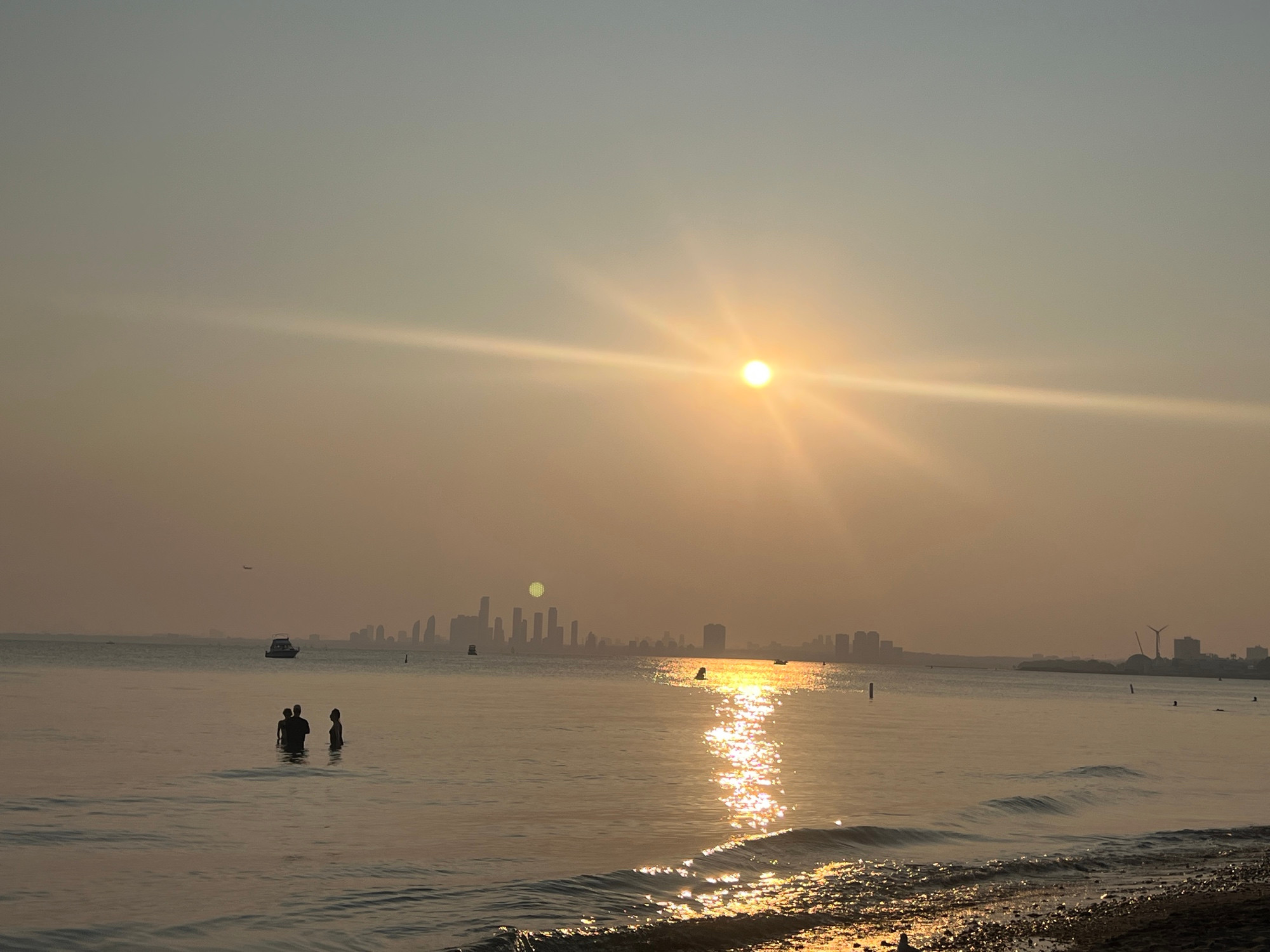 Etobicoke Rivera skyline in haze across water 