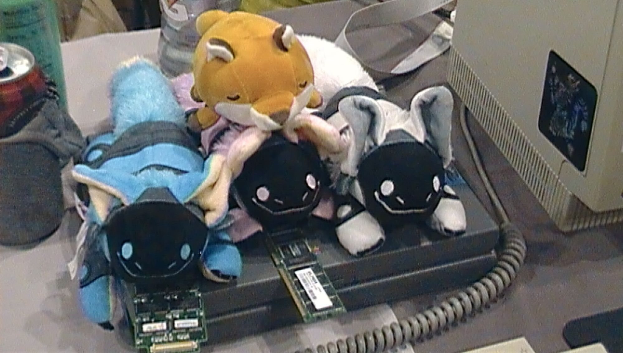 Photo of three protogen plushies and a fox plushie