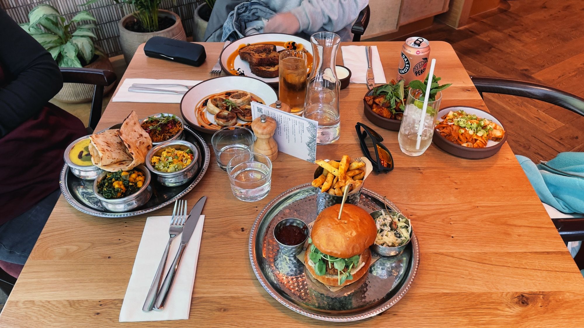 Table with lots of vegan food on it.