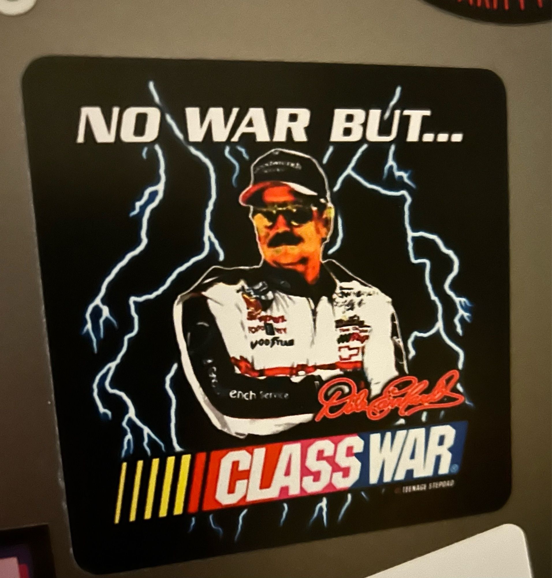 Dale Earnhardt sticker that says “no war but class war” the last two words in nascar font