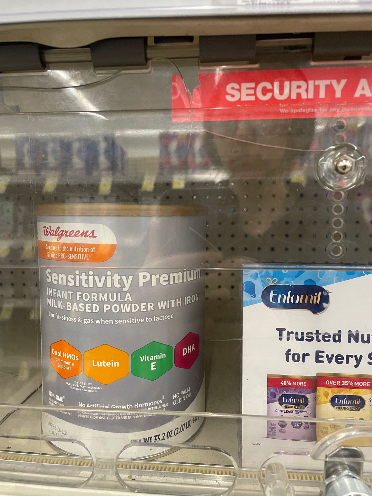 „Sensitivity Premium“ infant formula in a locked up shelf.