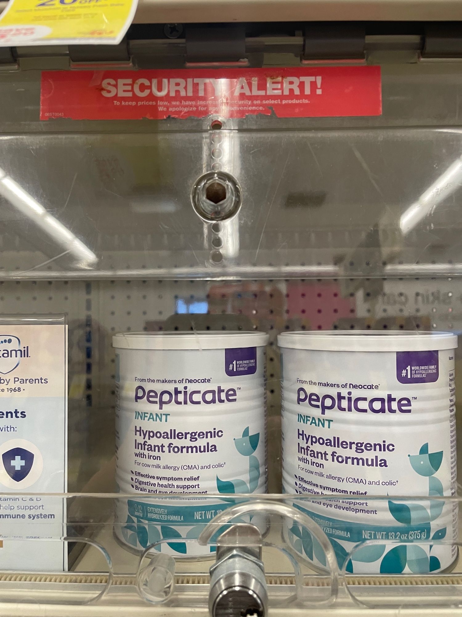 Hypoallergenic infant formula behind in a locked up shelf.