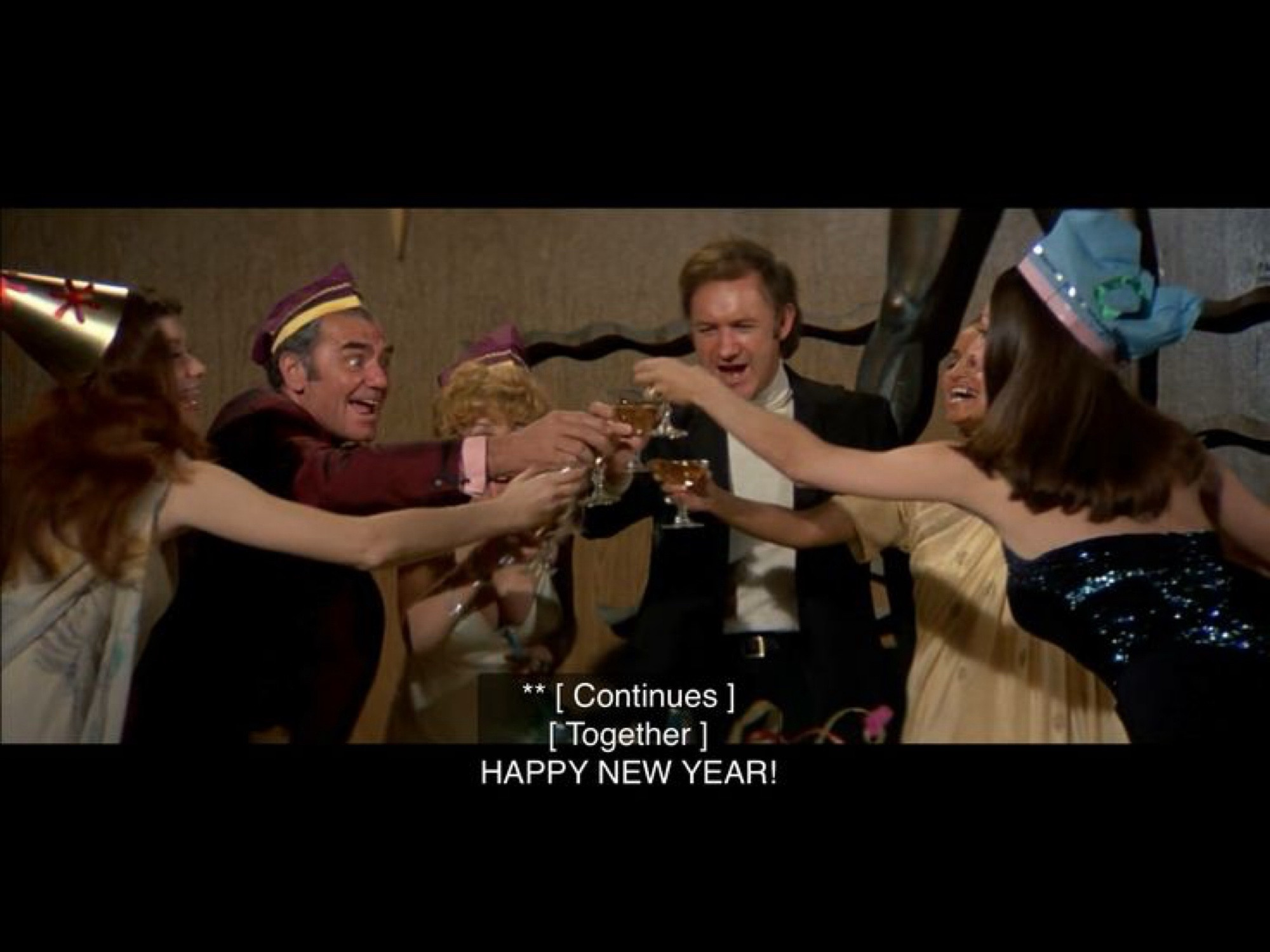 Characters in THE POSEIDON ADVENTURE wishing each other a happy new year.