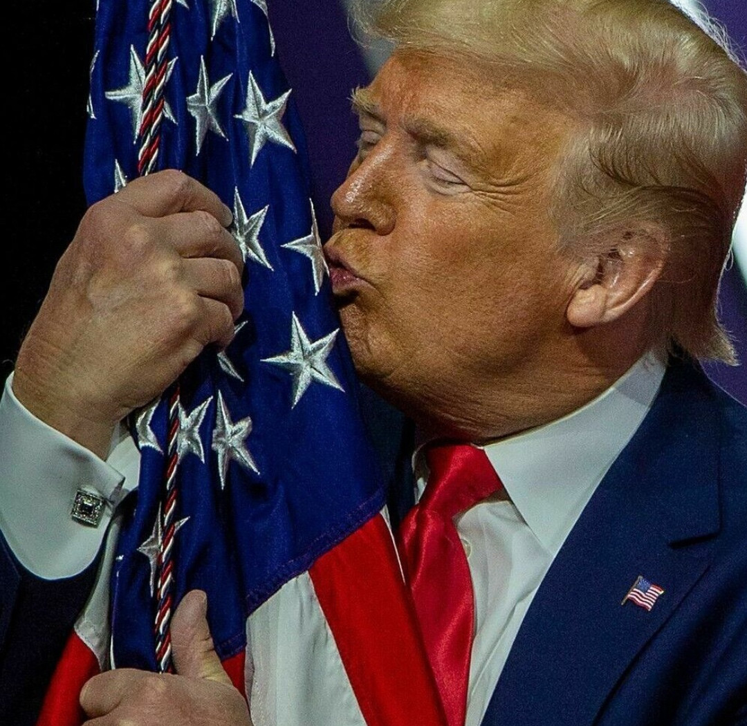 Trump kissing flag