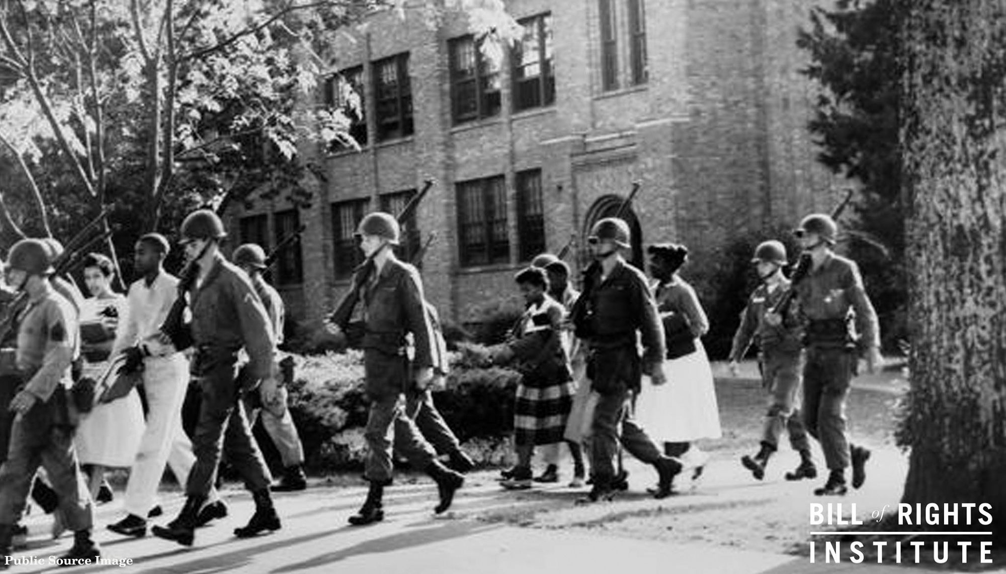 Federal troops ensuring compliance with federal law and the school integration of Little Rock, Arkansas