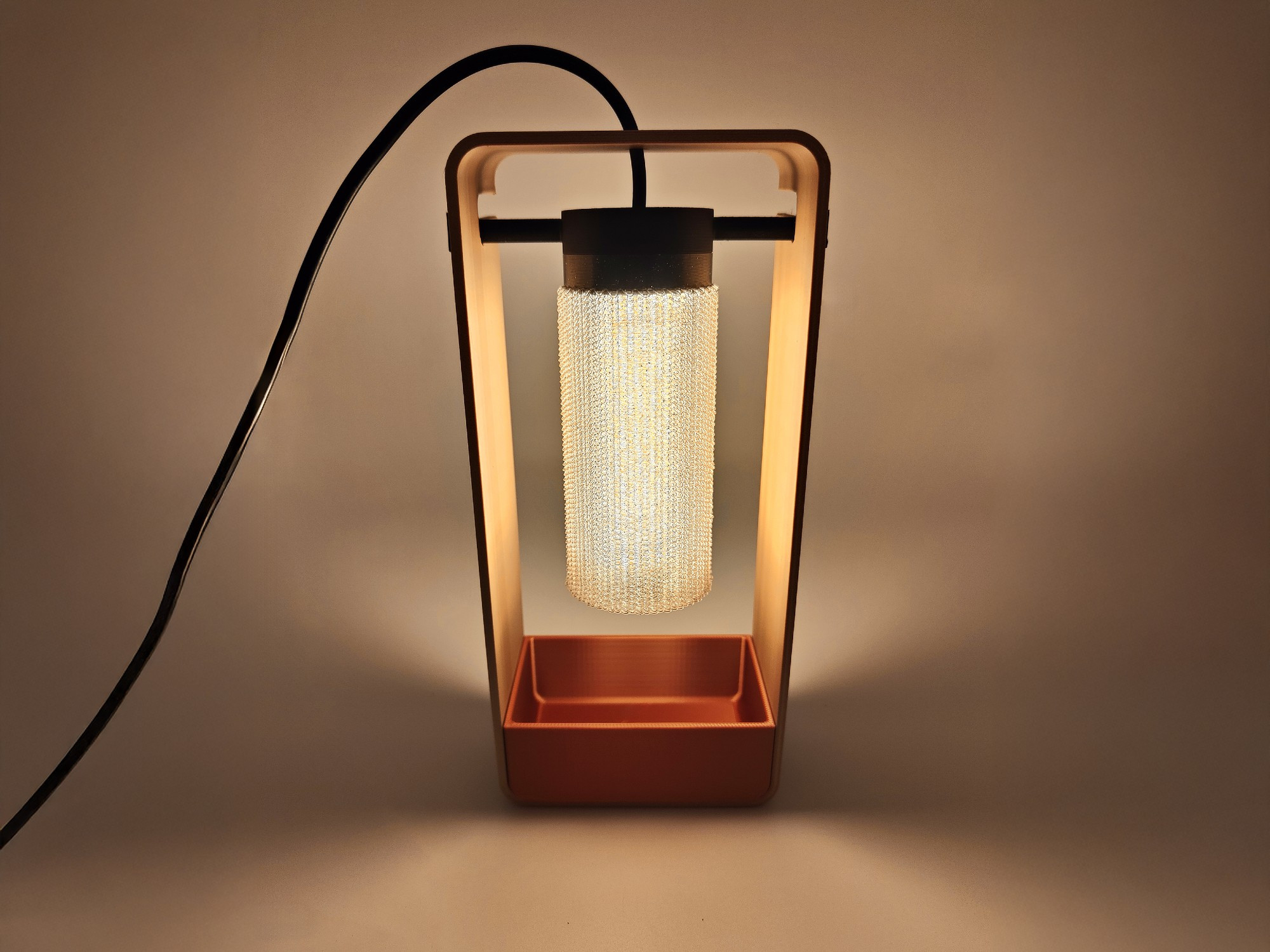 Phase is a modern and minimalist LED table lamp, standing out for its open structure and the originality of its lampshade.