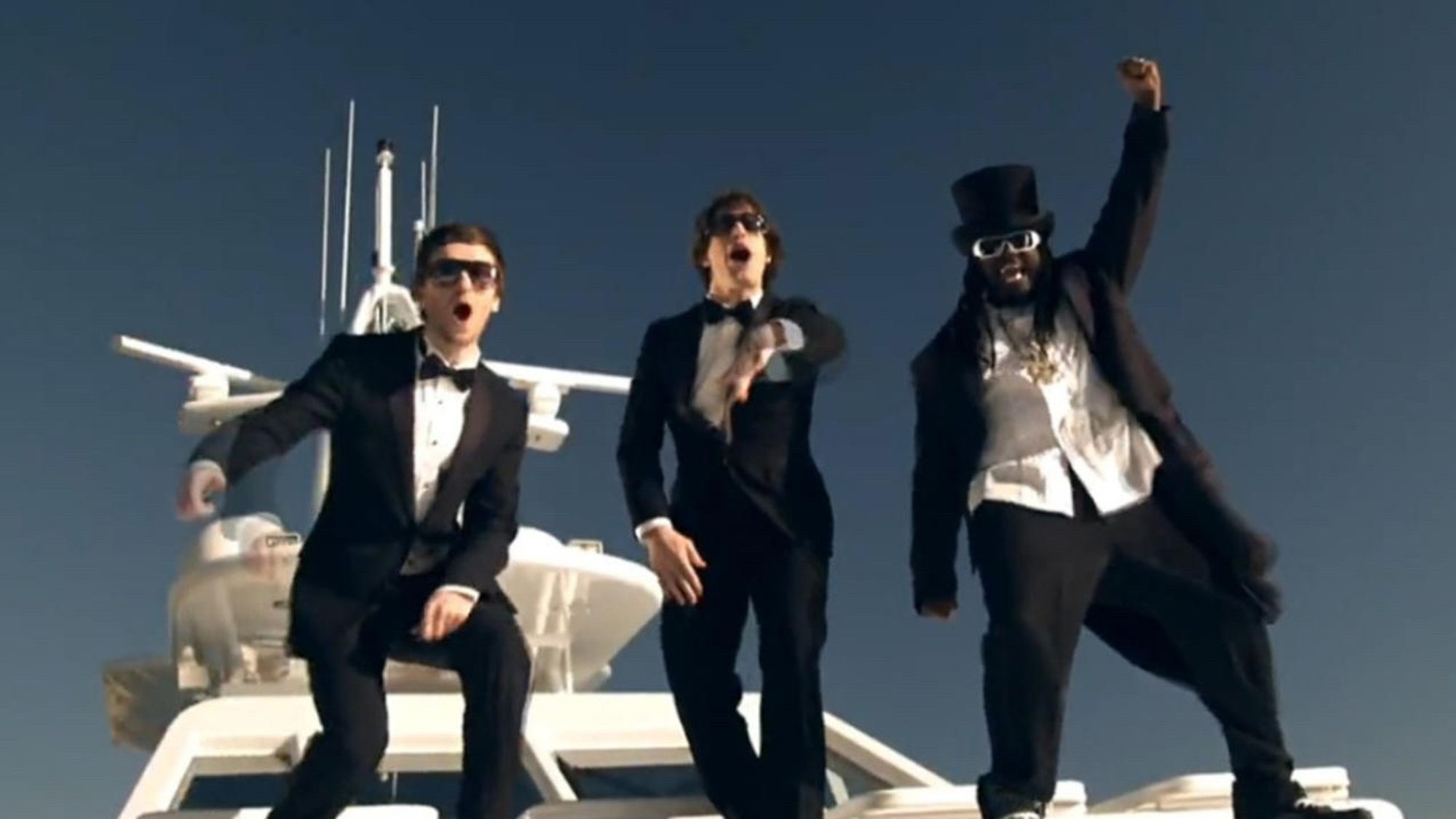 A picture of the Lonely Island and T-Pain in tuxedos on a boat from the song: “I’m on a Boat” by The Lonely Island.