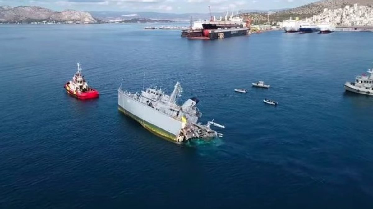 Greek warship HS Kallisto, or at least half of it, being dragged back into harbour after losing an argument with a container ship. I guess we need to rename it Kall, huh?