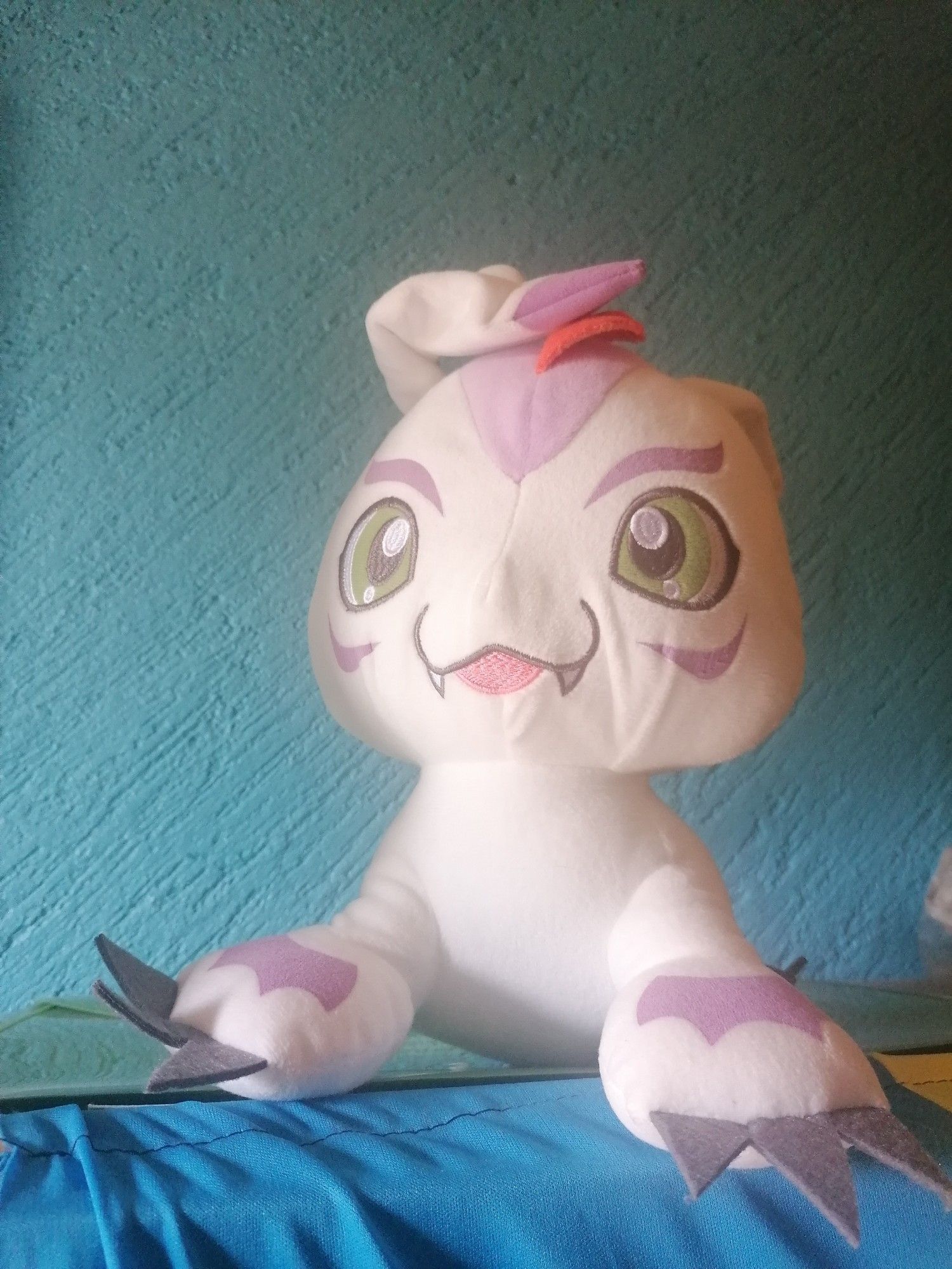 A photograph of a Digimon plush named Gomamon