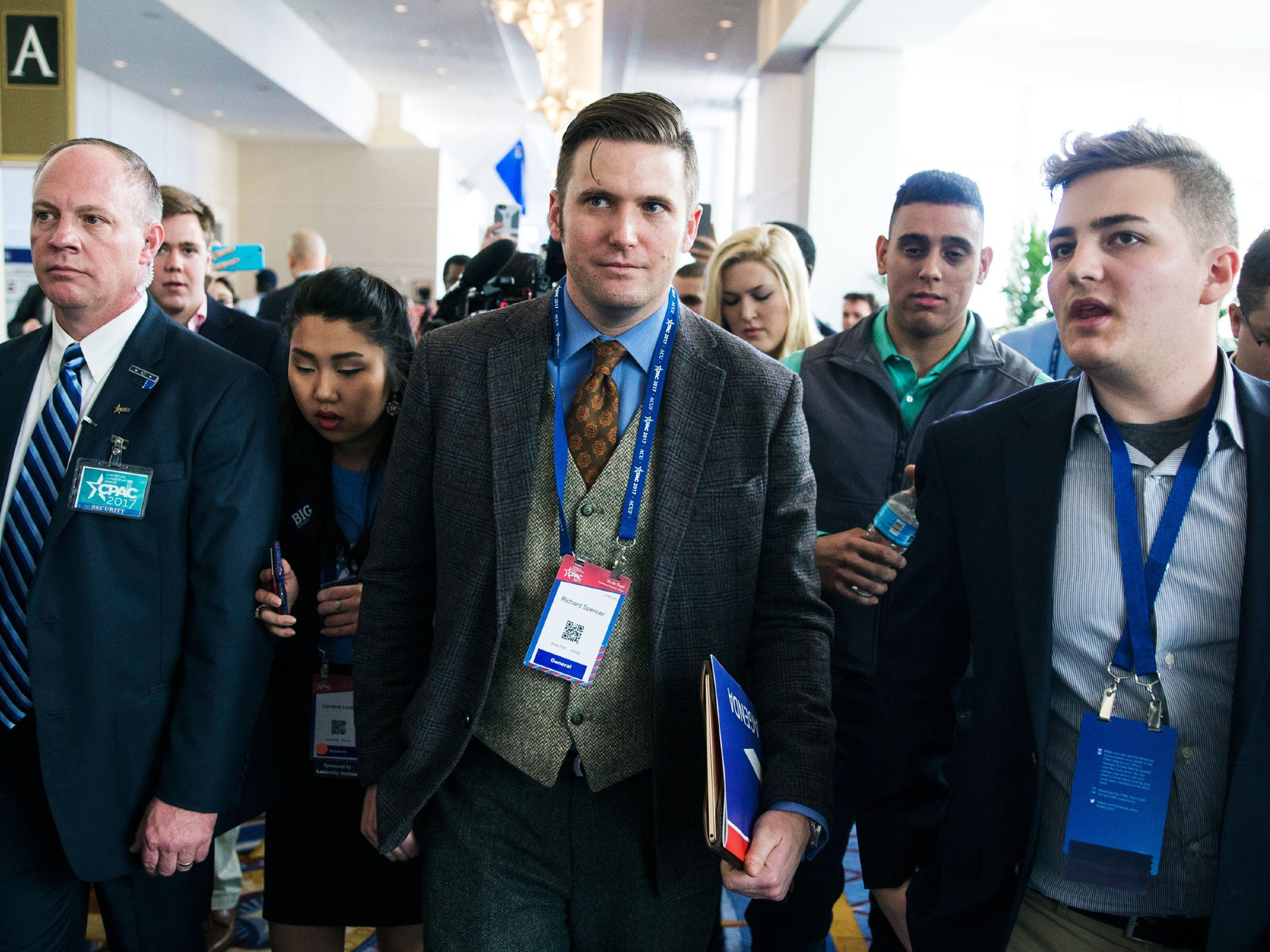Cesar Subervi at CPAC 2017 behind Richard Spencer