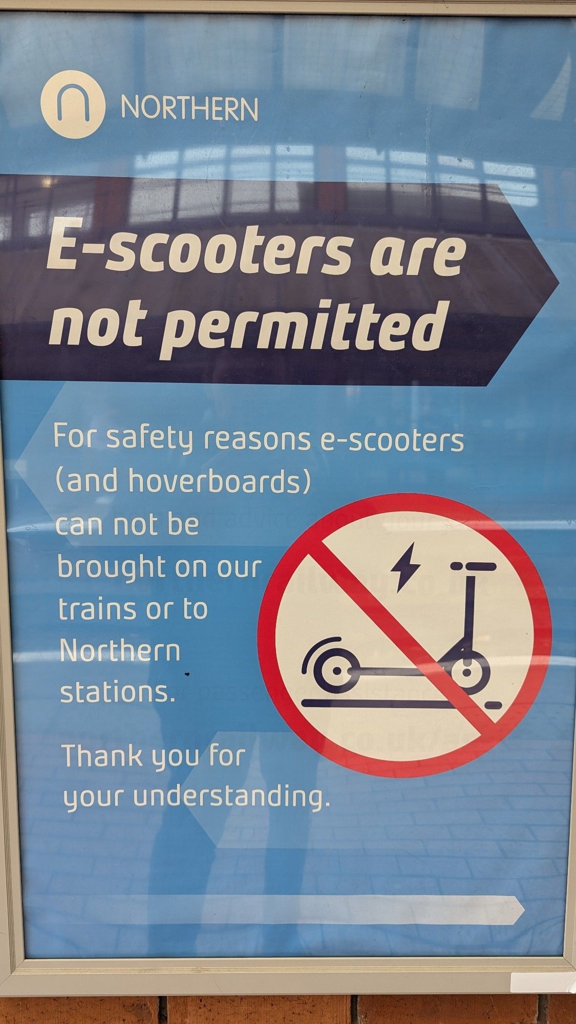 Northern Trains passenger safety sign - no e-scooters or hoverboards....