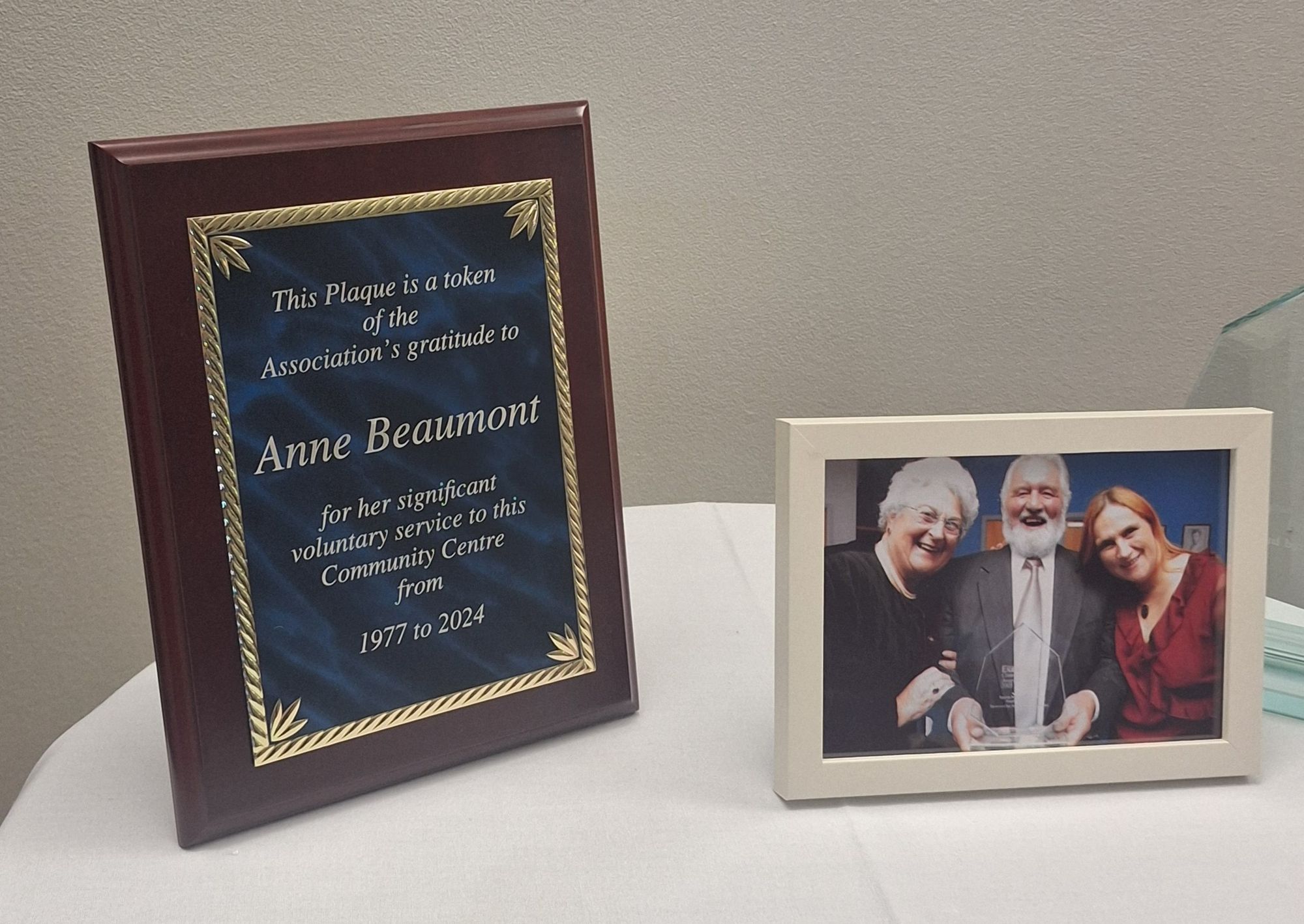 A commemorate plaque given to my grandmother for her service to Wooldale Community Centre over many years. The dedication reads 'This plaque is a token of the Association's gratitude to Anne Beaumont for her significant voluntary service to this Community Centre from 1977 to 2024'