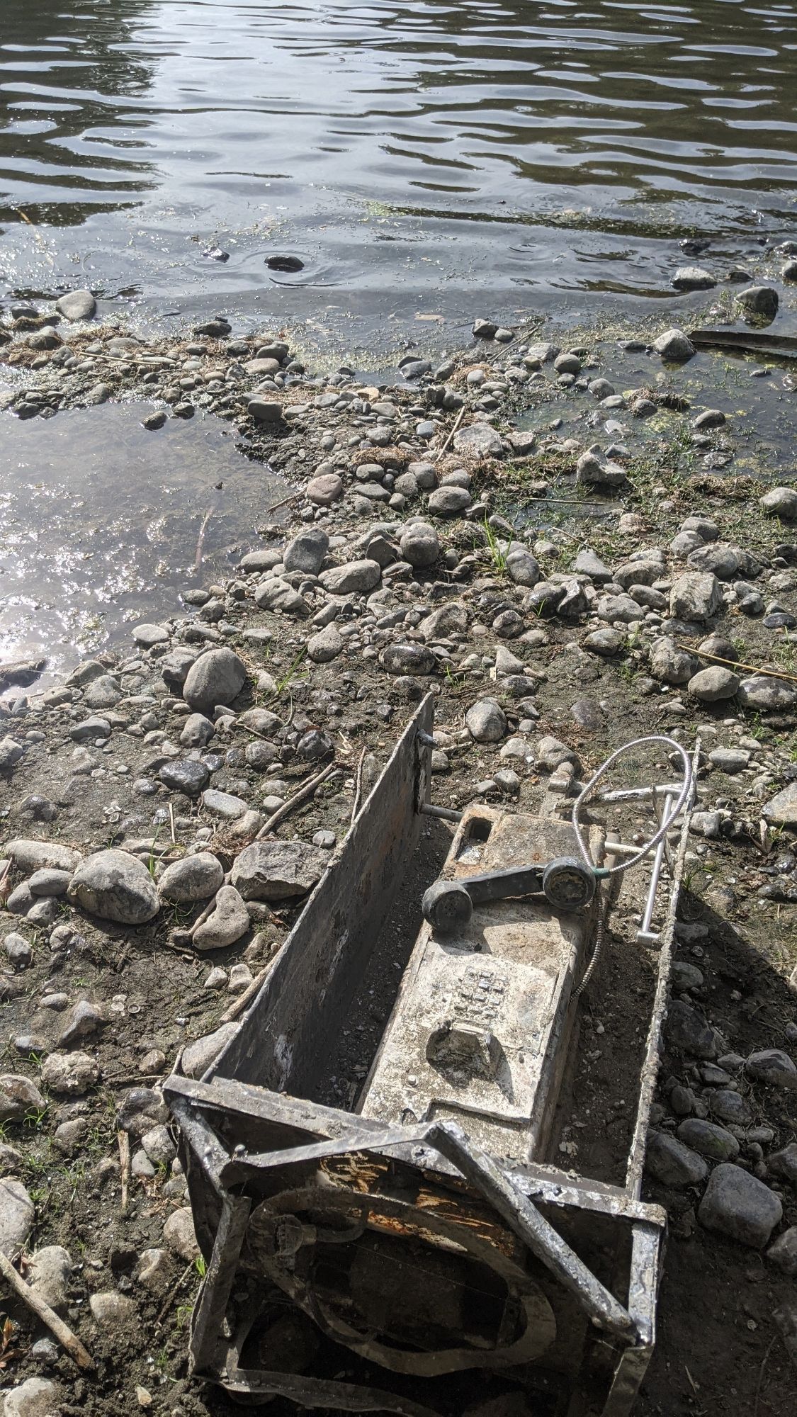 An old payphone on the shore of the lower Yakima River