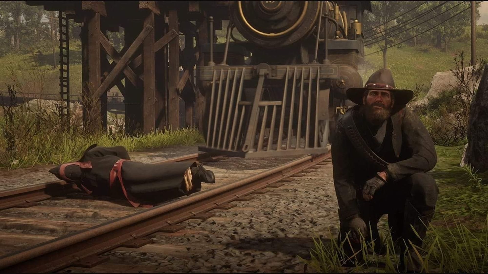 Arthur Morgan taking a selfie with a KKK member hogtied on train tracks seconds before the racist is ran over by a train