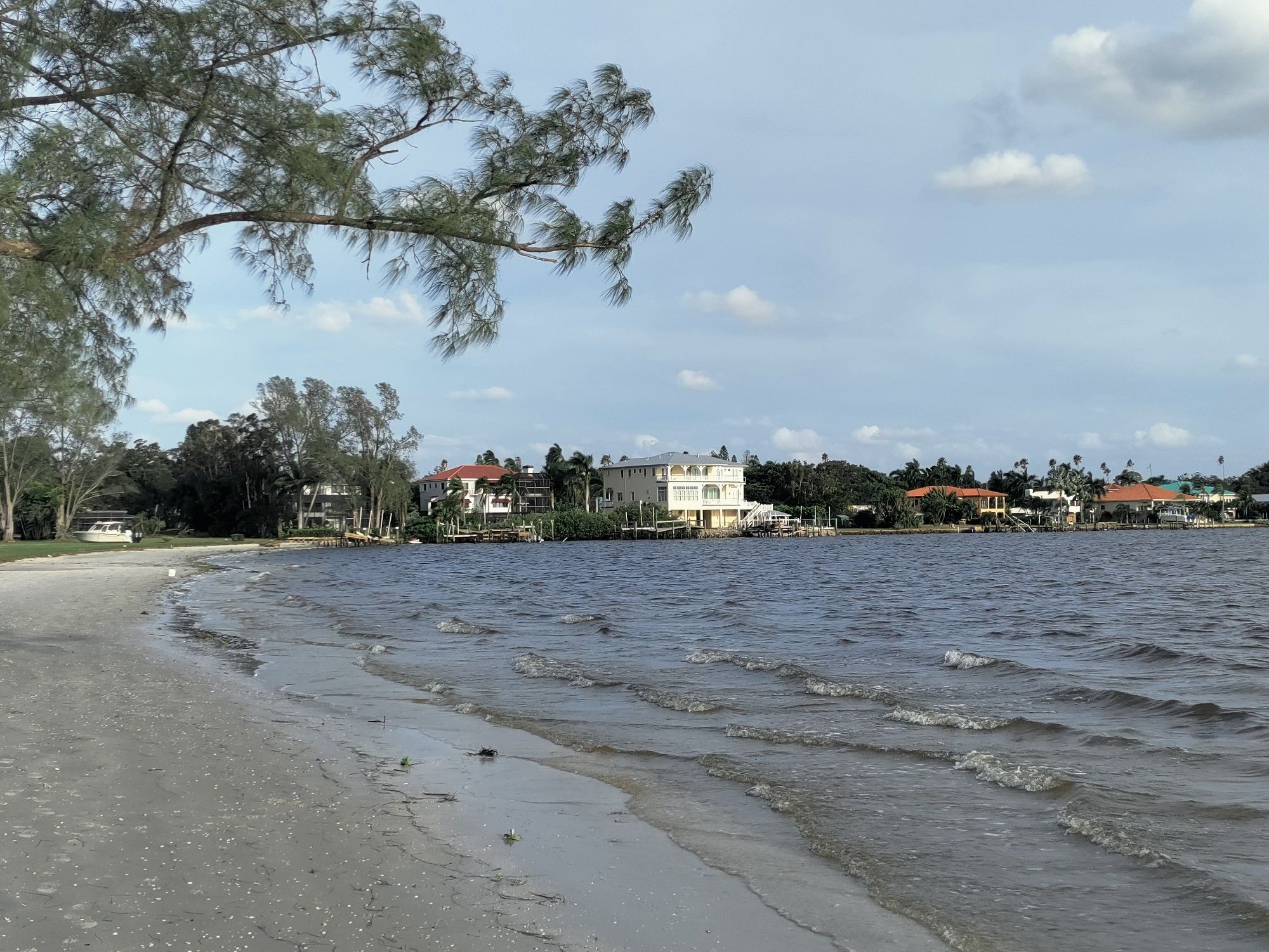 Rich fuckers sat in their mansions watching the upper class plebe sailboats bob around in the surf.