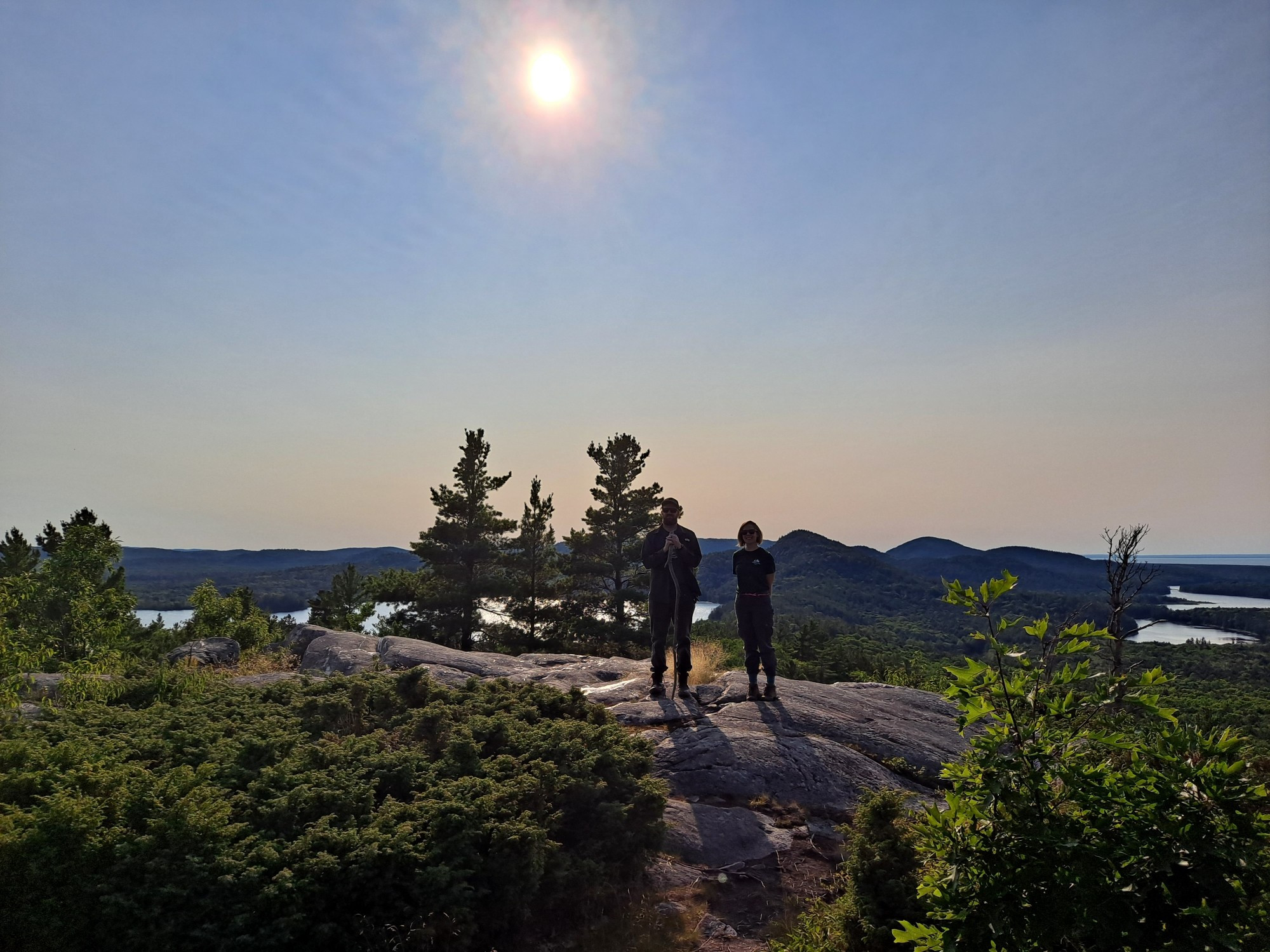 Two people on a rocky mountain.