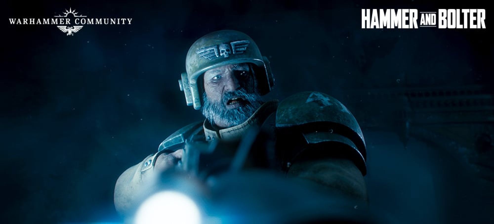 A heavily armored soldier with a glowing light source in dim lighting, with "Hammer and Bolter" text.