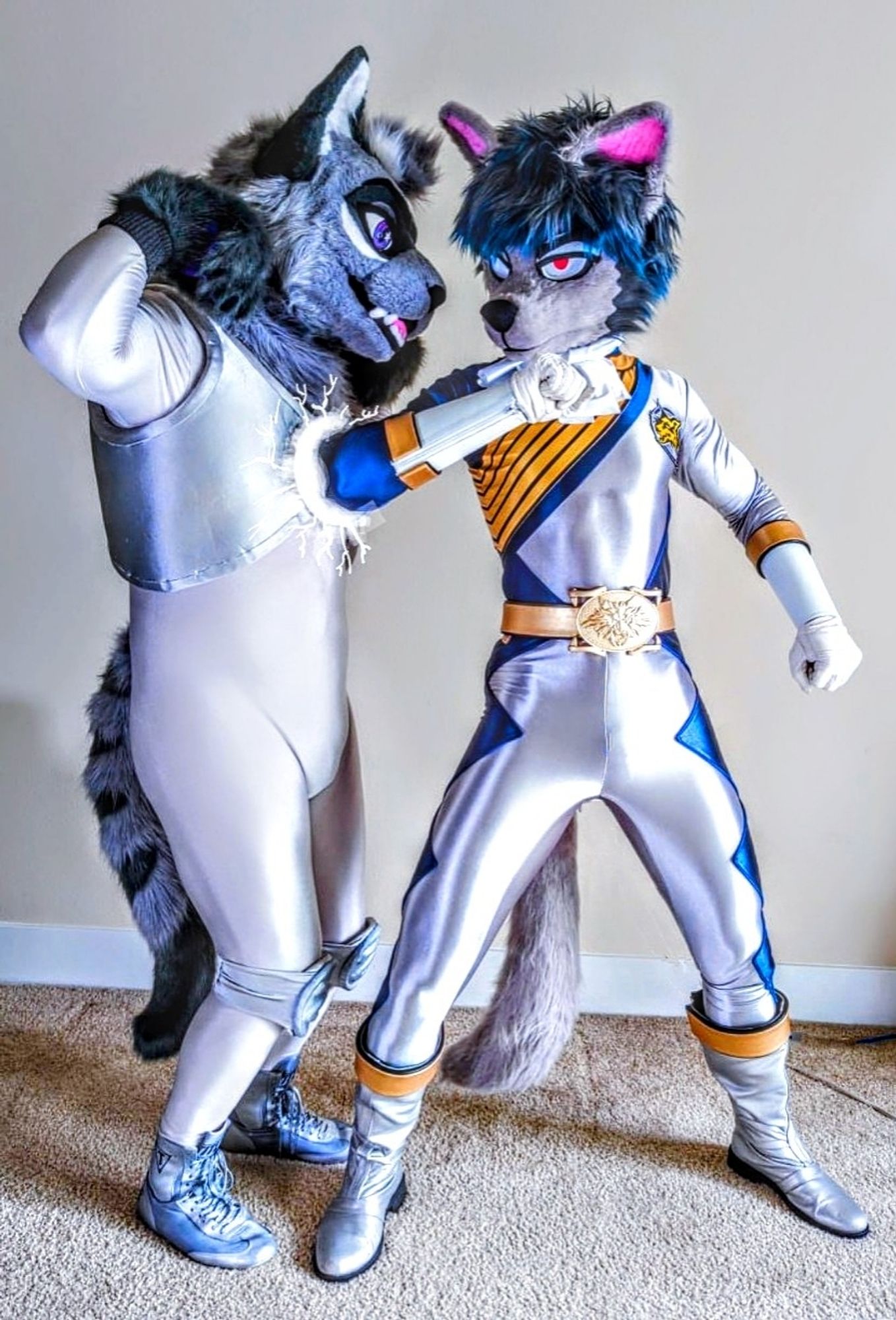 Two fursuiters dressed in spandex. The wolf fursuiter is punching the cat fursuiter in the chest.