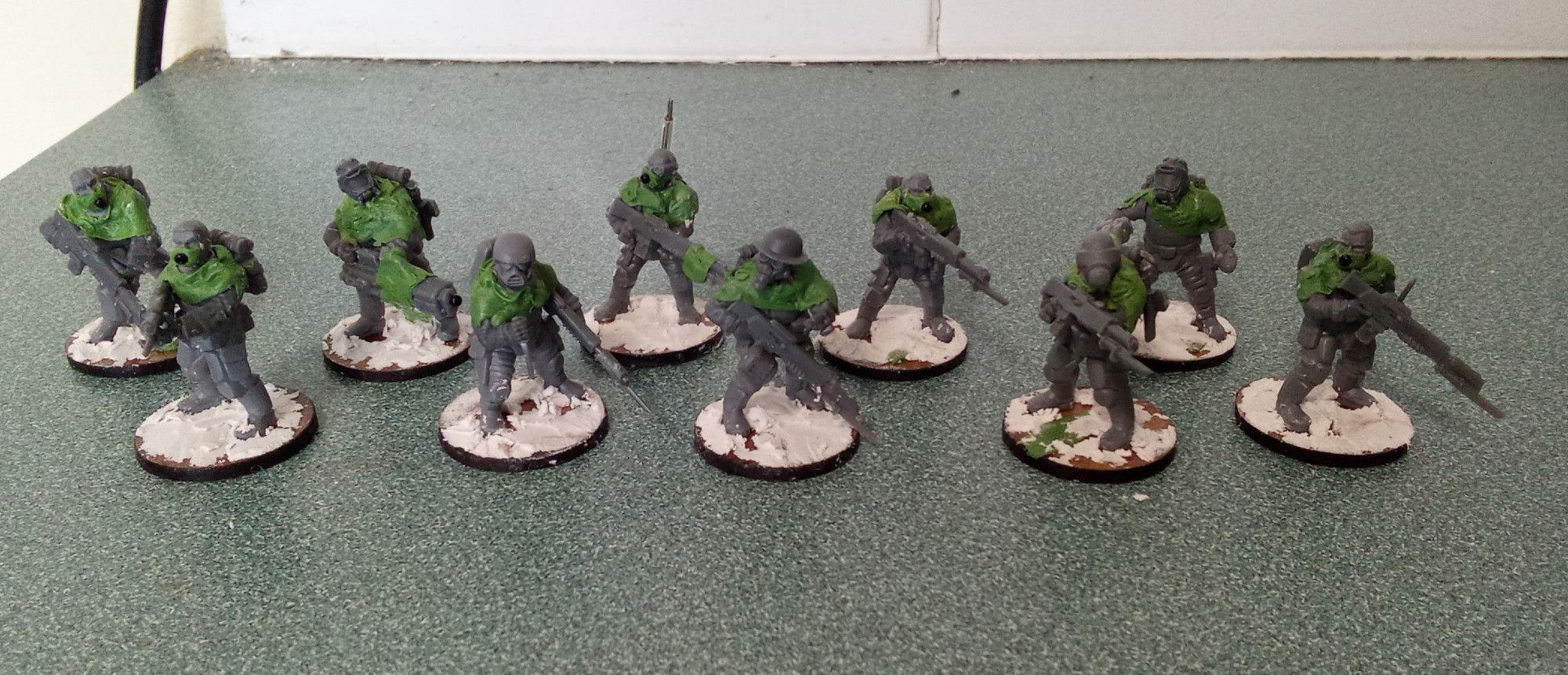 Ten assorted scfi infantry gun dudes. Its not an especially uniform group, with a variety of gasmasks and helmets.