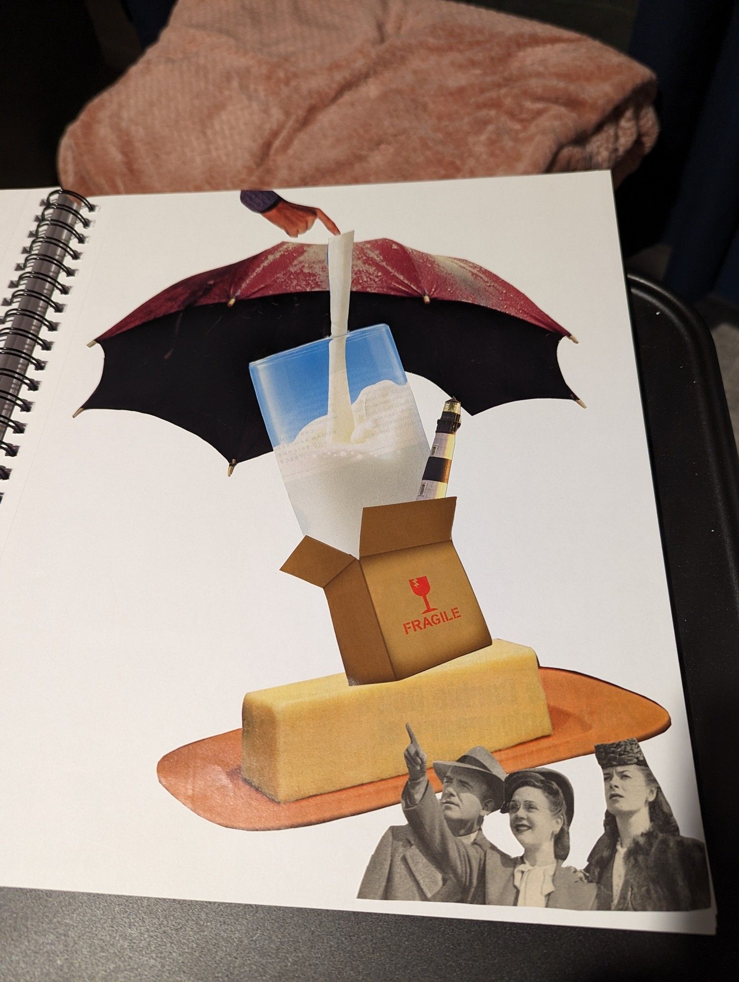 Collage on a white background of mixed magazine pieces. Pointing hand over a purple umbrella. The hand touches the top of a straw into a large glass of milk which is coming out of a cardboard box marked fragile. Also in the box is a lighthouse. The box sits on a stick of butter on a tray. Below the butter are three 50s styled white people pointing up.