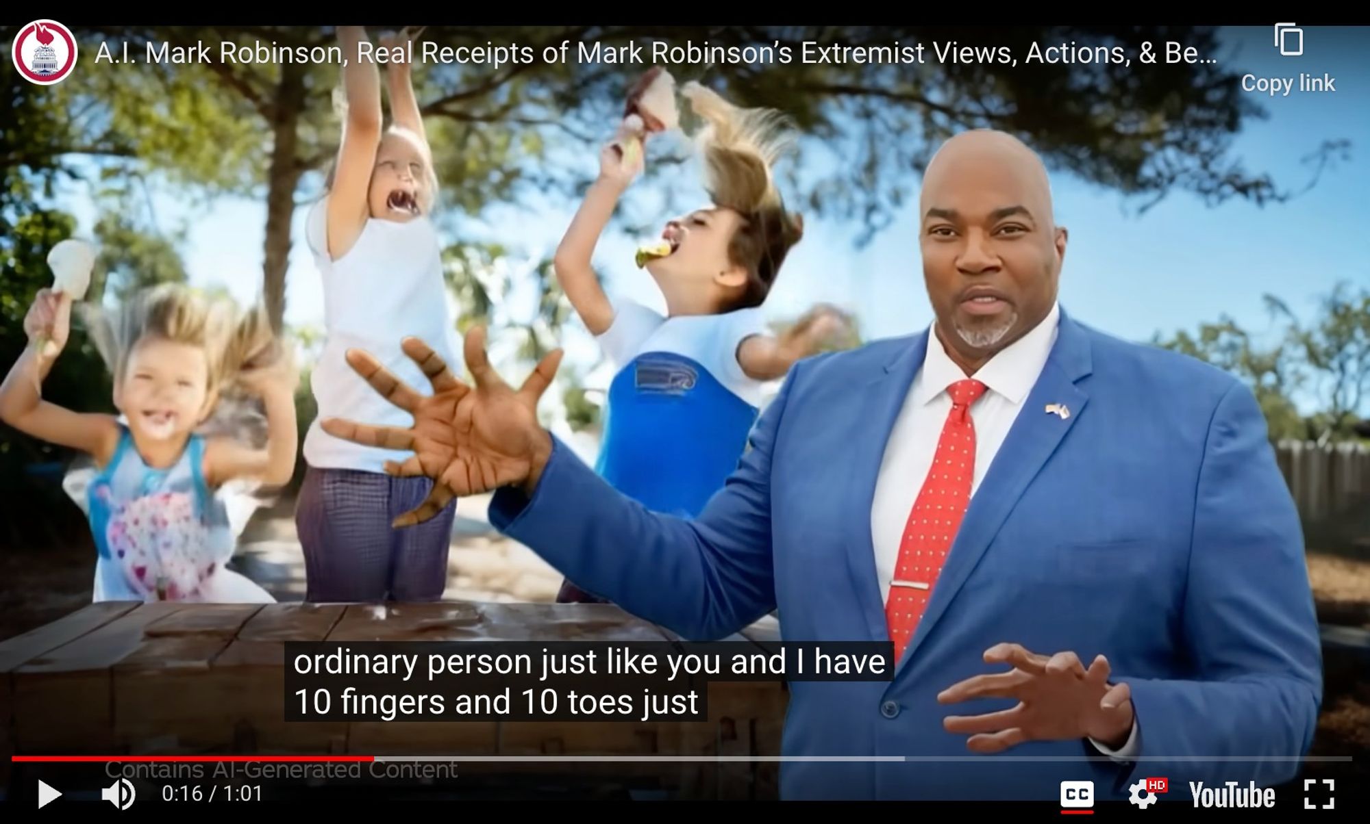 YouTube video. Titled "A.I. Mark Robinson, real receipts of Mark Robinson's extremist views, actions…" Mark Robinson, an uncanny AI of a bald Black man in a blue blazer holding out eight fingers. Captioned "ordinary person just like you and I have 10 fingers and 10 toes just…"