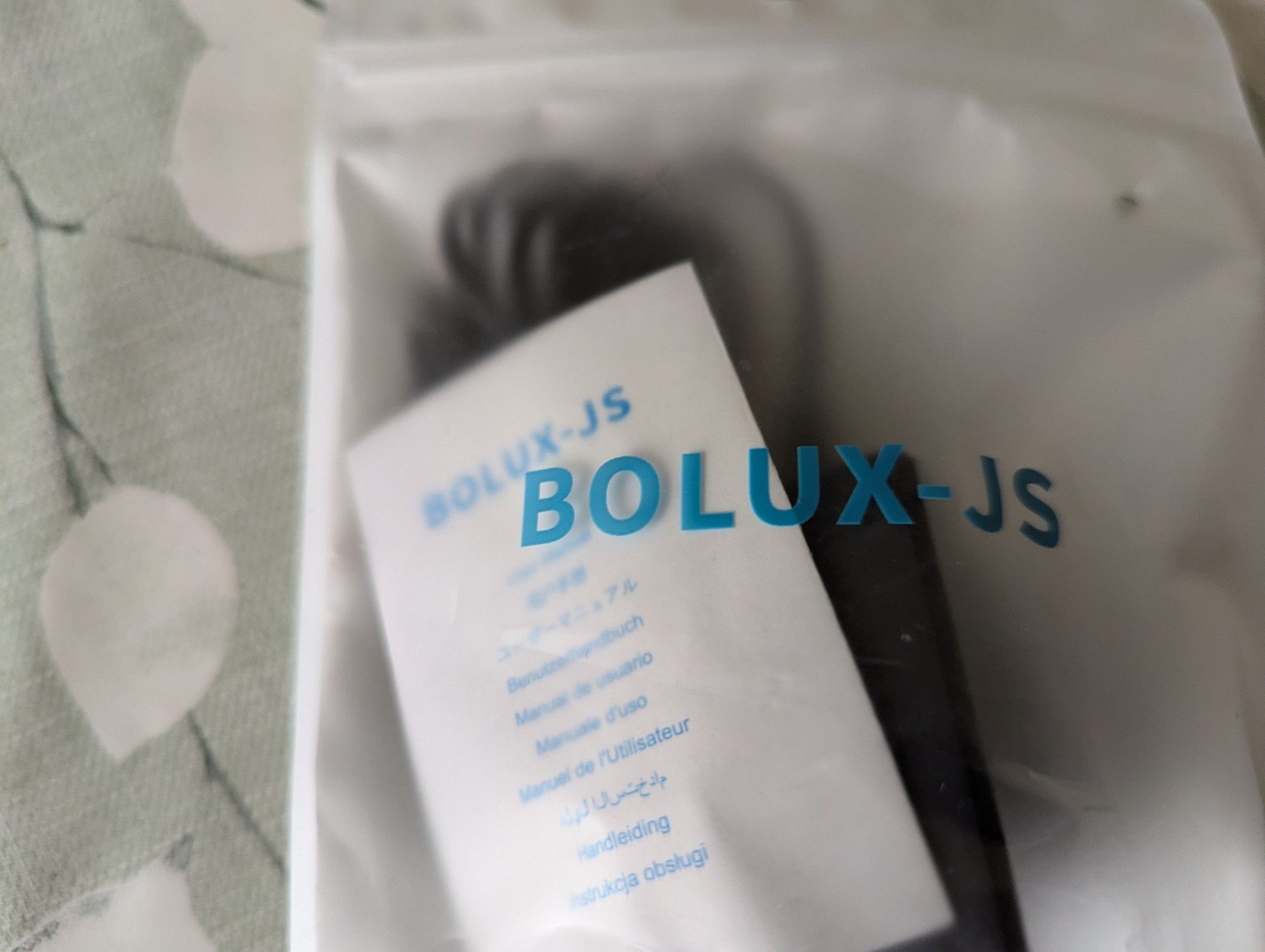 Electric razor charger in its bag - brand named Bolux JS.