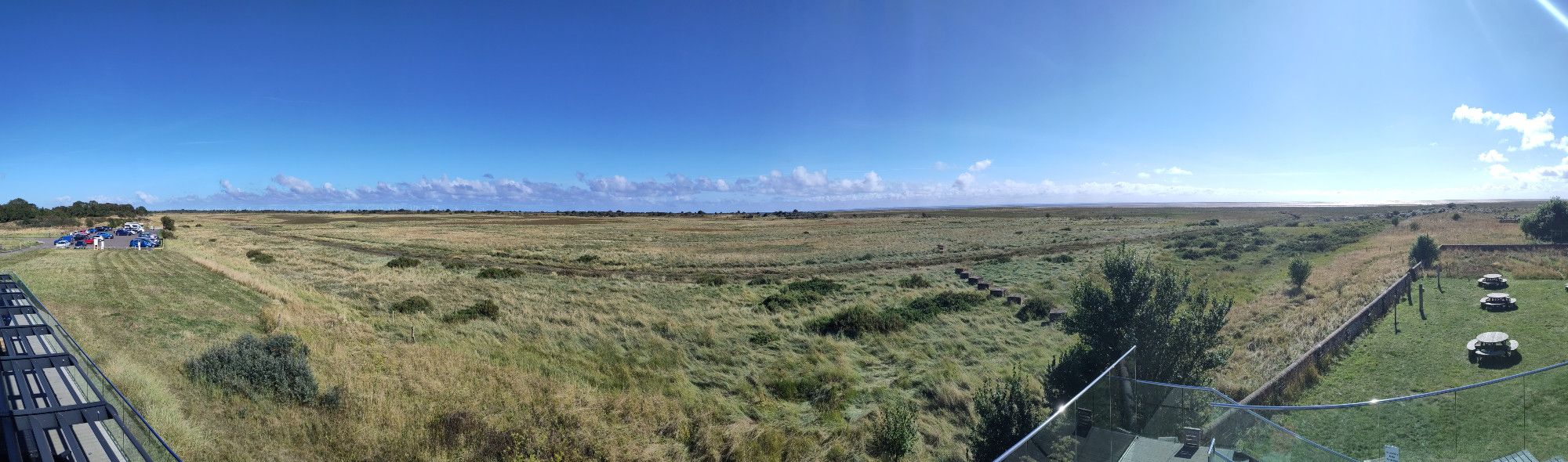 A panoramic view from the visitor centre at Gibraltar Point showing mostly a salt march but also the wind farms offshore from Skegness, The Wash and the Norfolk coast.