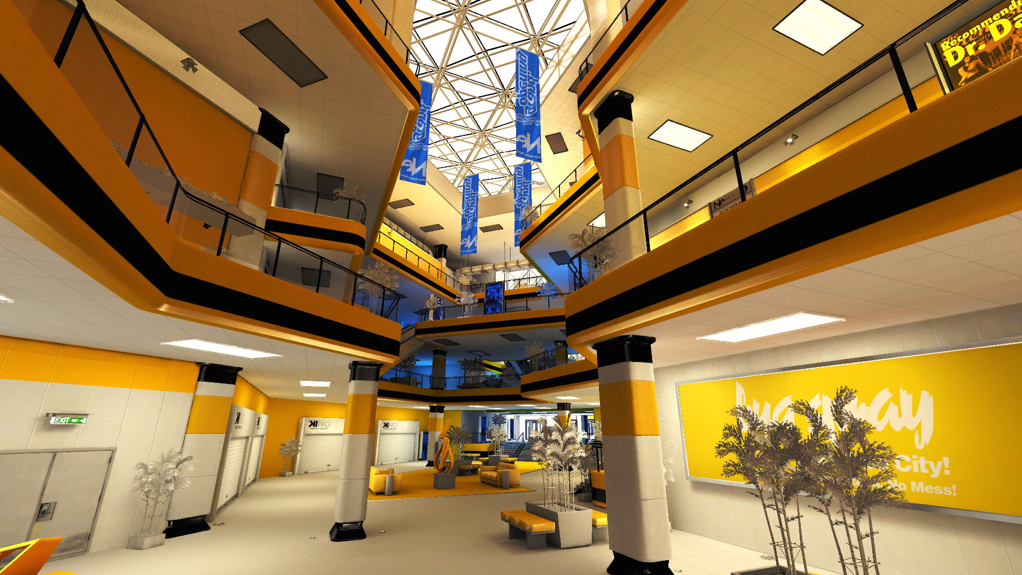 the interior of a mall, the dominant colour is orange/yellow. there is a glass roof ceiling, there are flags for the mall which are blue. there are 4 levels