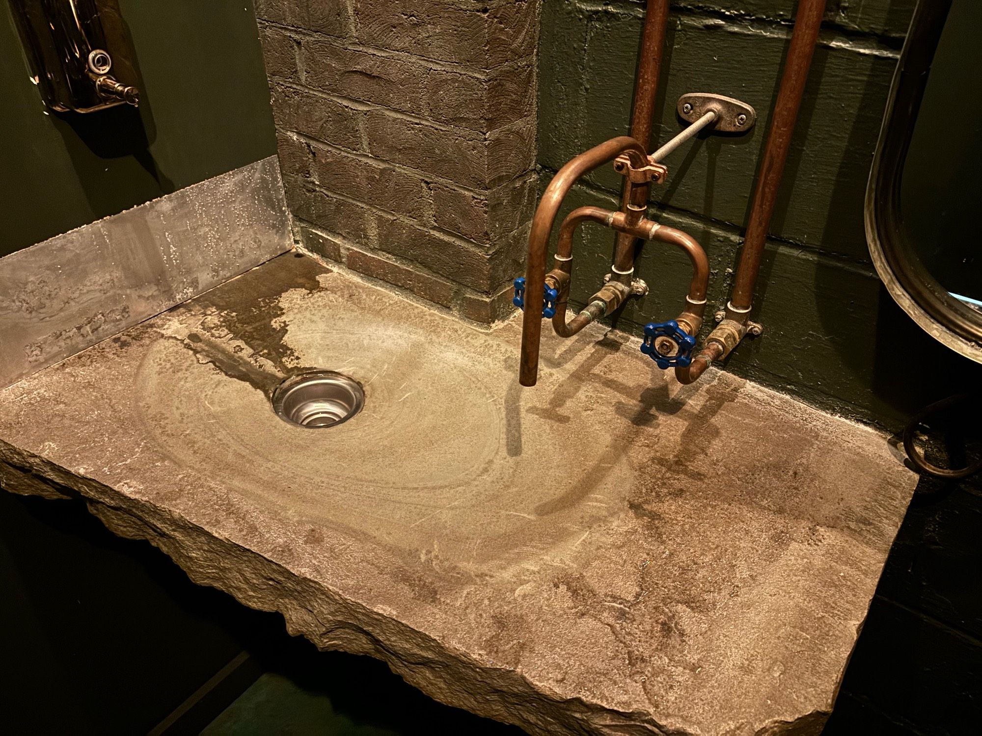 Sink with pipe openings for faucets