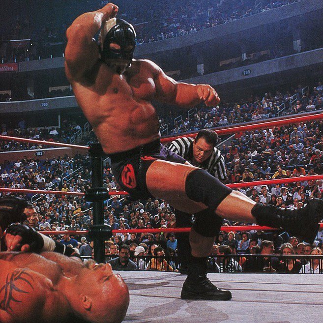 Photo of a masked monster of a human being Scott Steiner about to drive his meaty elbow through the chest of a prone Bill Goldberg, WCW Fall Brawl (September 17th, 2000)