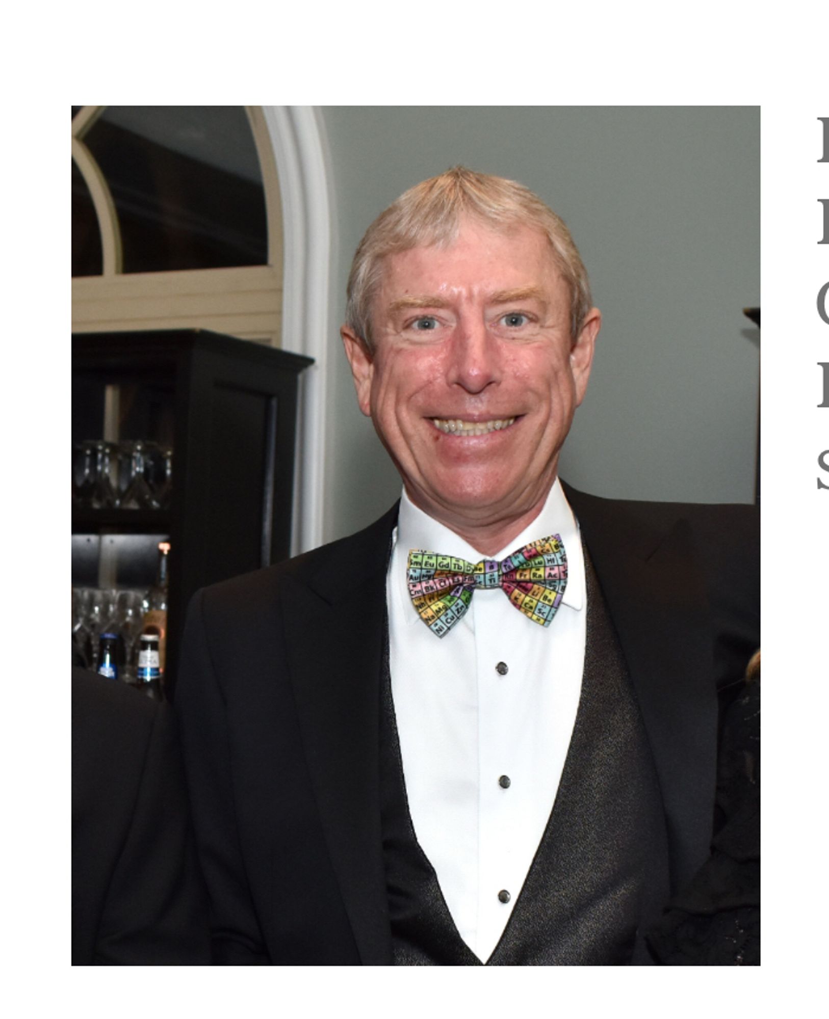 Frank Brunkhorst III, co-CEO of Boar’s Head, wearing a smile that was taught to him by the Joker. He is wearing a Tux with what appears to be a mildly psychedelic bow tie. 