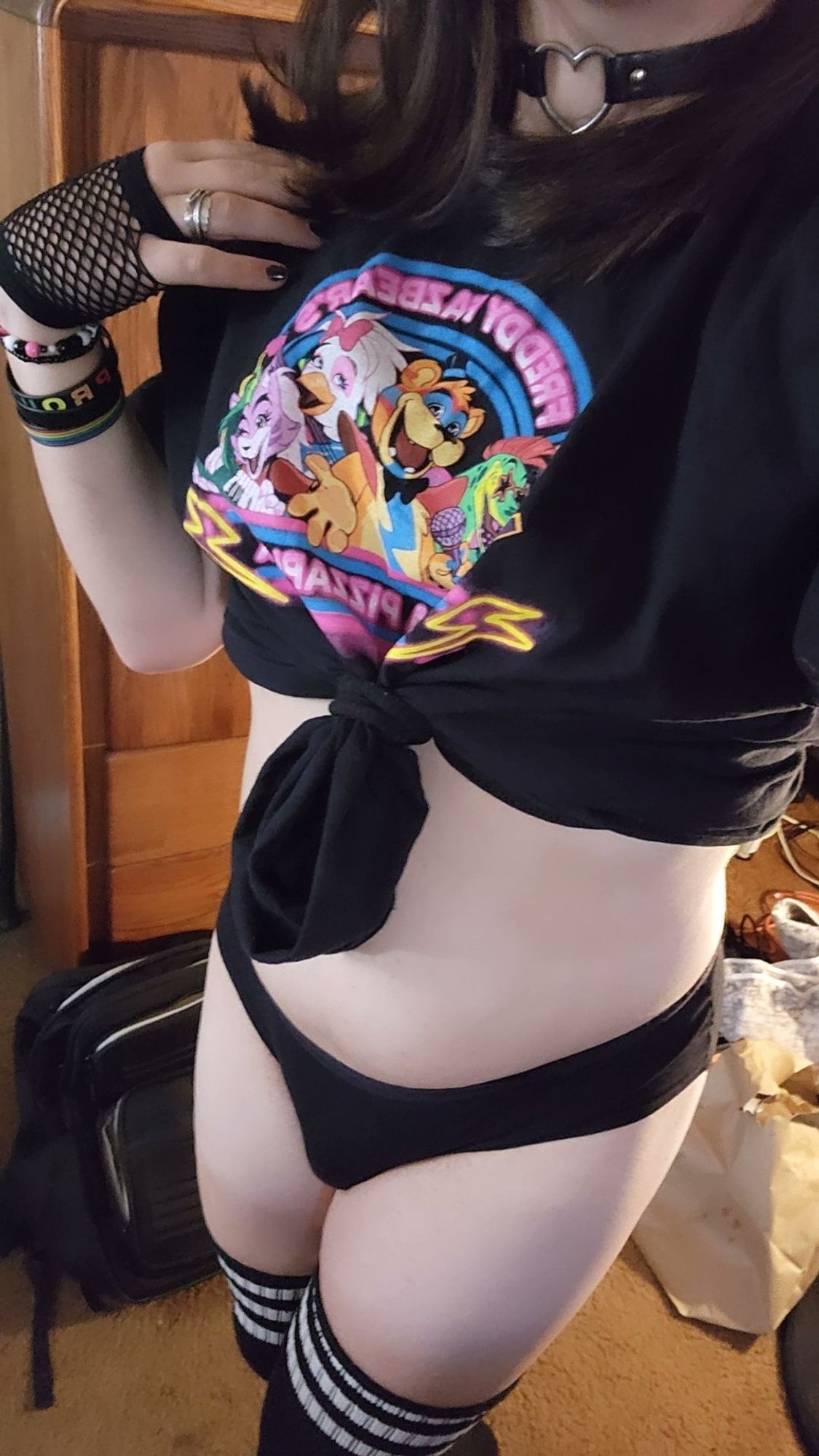 A woman wearing a cropped Five Nights at Freddy's shirt and thigh high socks - skyhub -