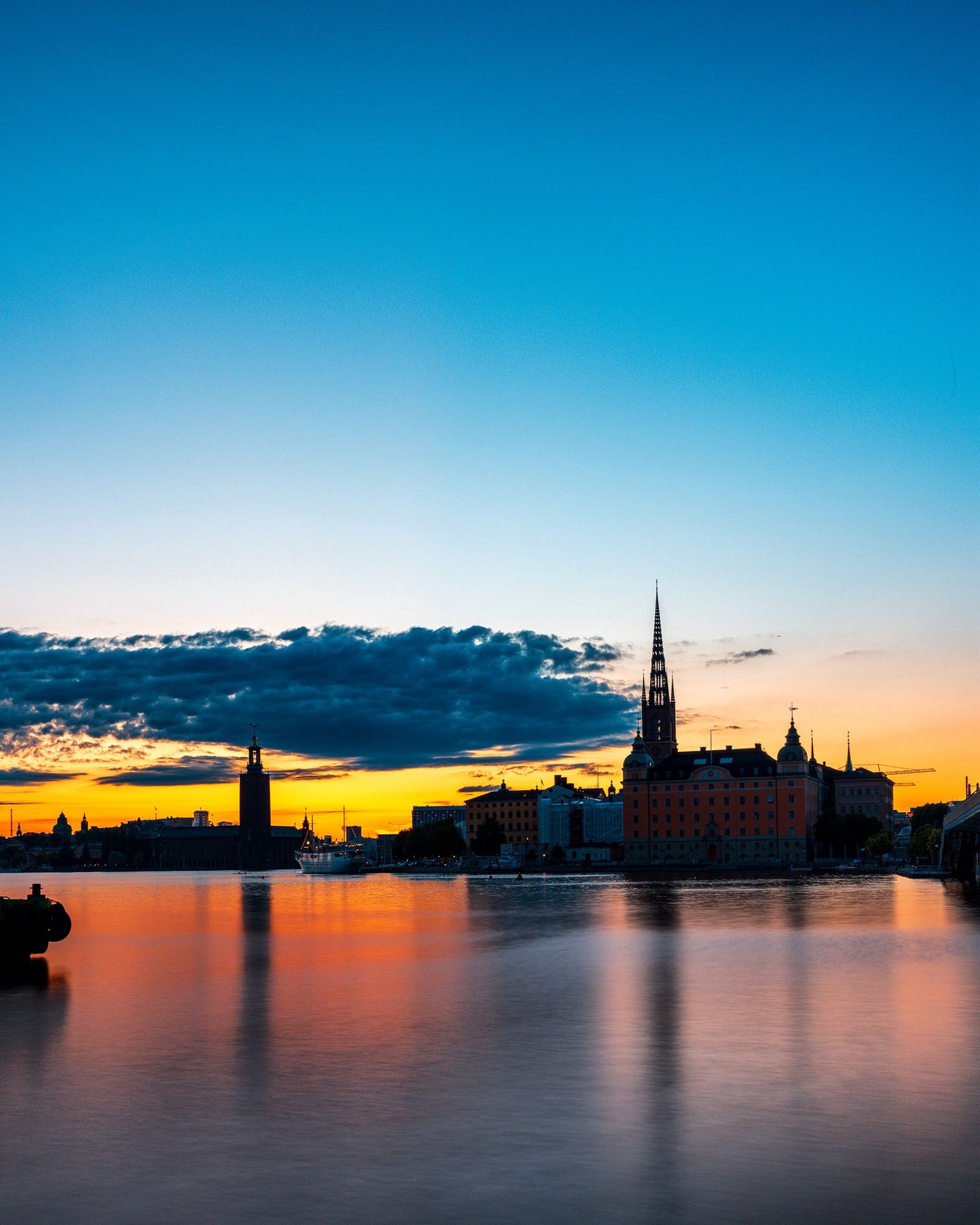 Sunset view of Stockholm old town with golden light in the horizon