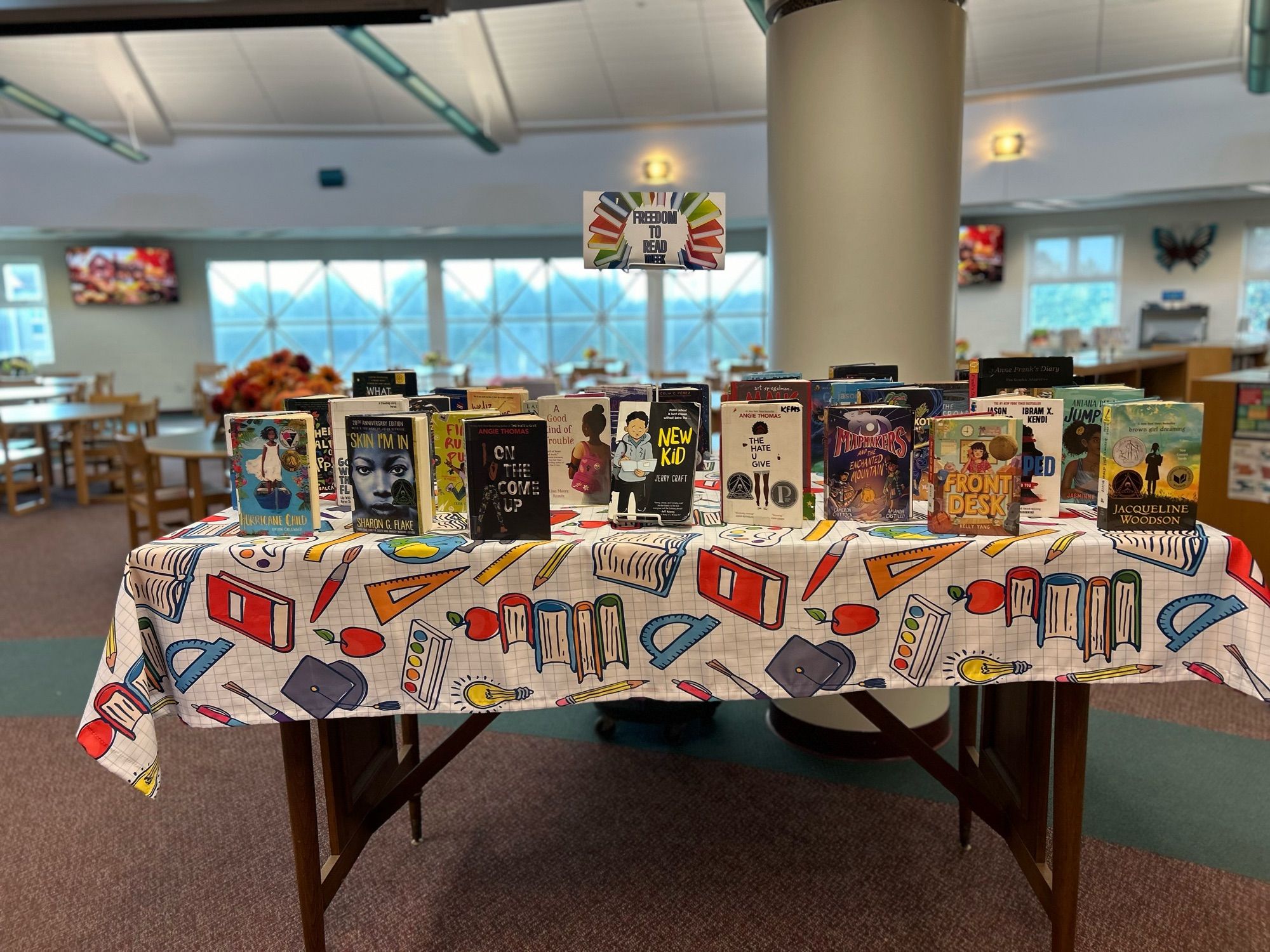 Display of books in a middle school library with a sign that says Freedom to Read Week