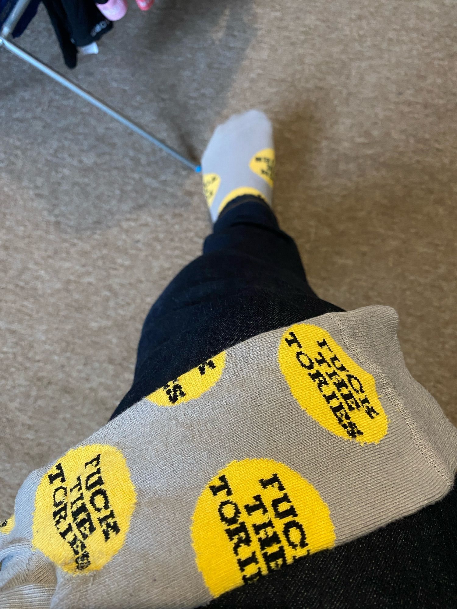 An excellent pair of grey socks with large yellow polka dots. In each of the dots, in black, slab-serif type, reads the legend ‘FUCK THE TORIES’.