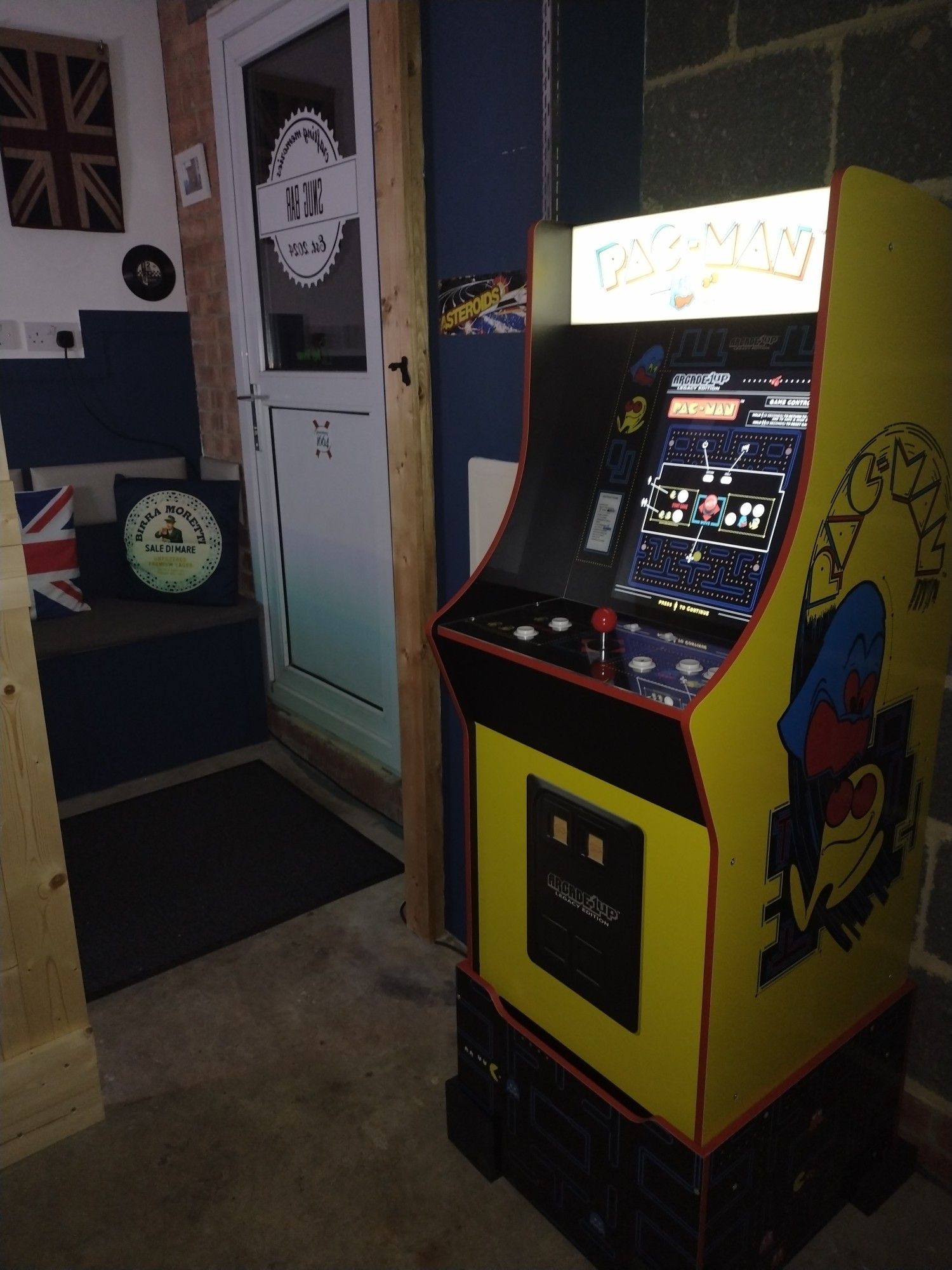 Pac-Man arcade machine in a mancave