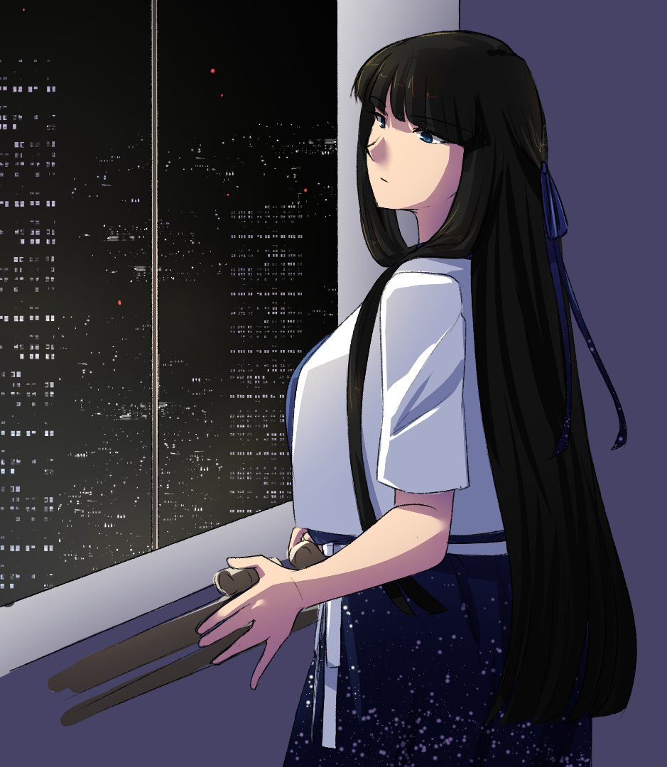 a woman staring out at a night city from a window