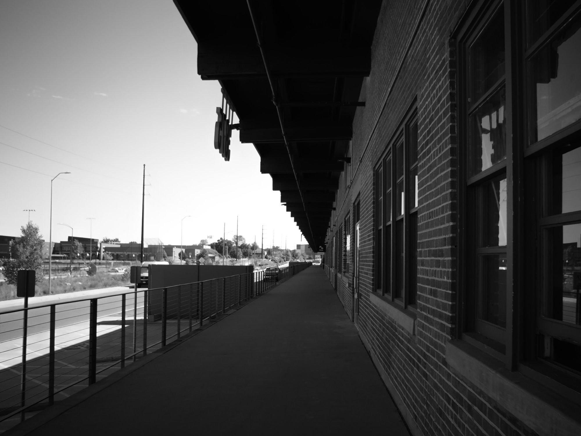 A raised section running along revitalized warehouse spaces.