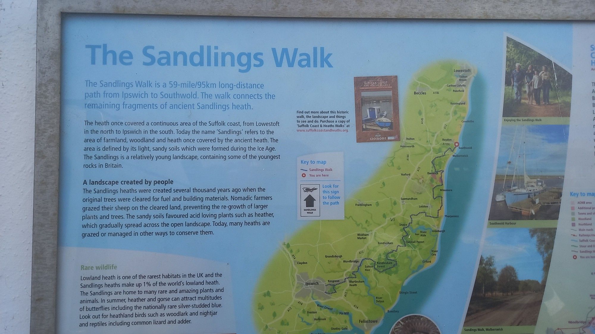 The Sandlings Walk information panel on the wall at Southwold Pier