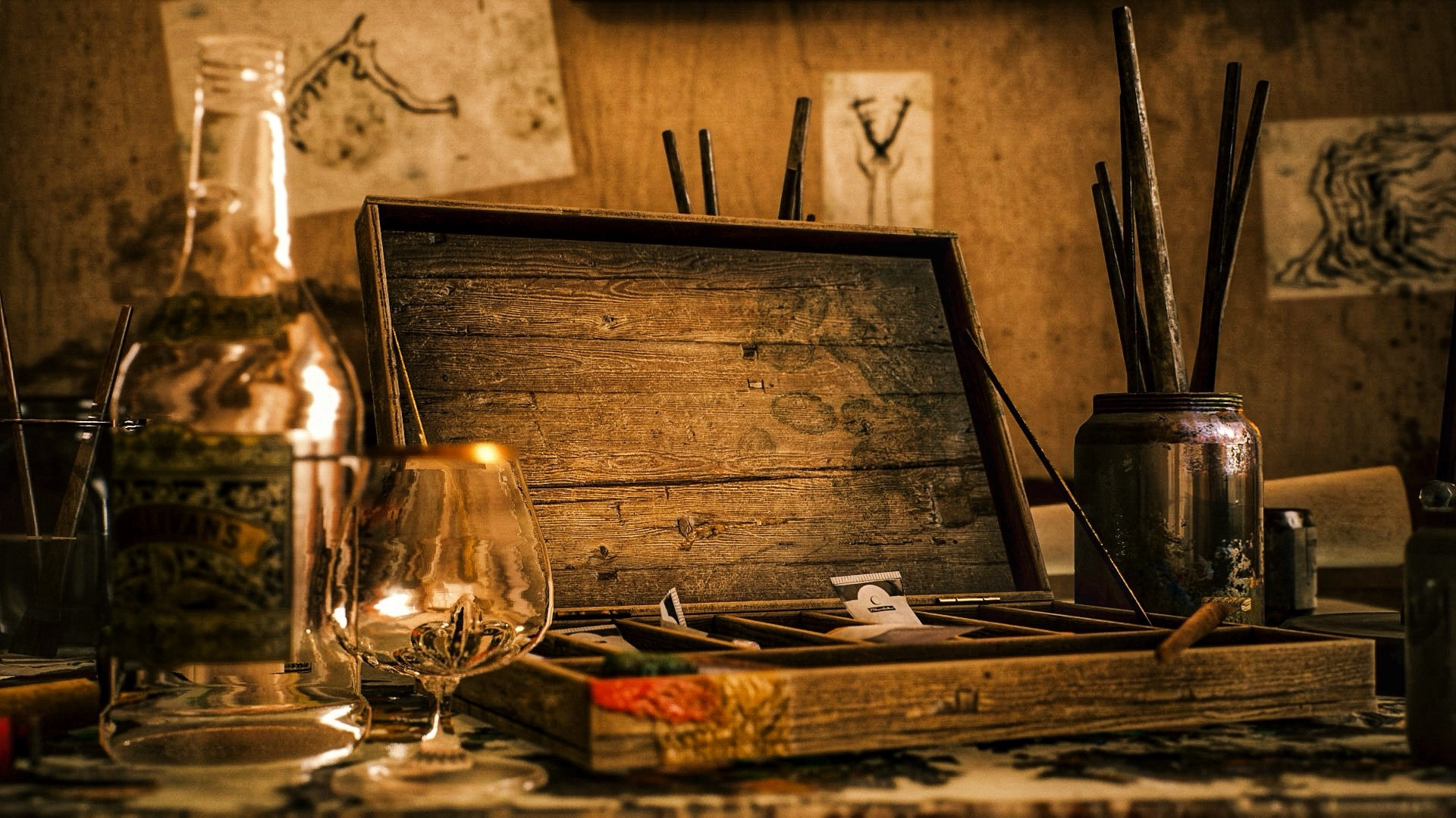 A close up shot of an artist’s wooden supply case, with a jar of used paintbrushes to one side and a bottle of liquor and a glass to the other.