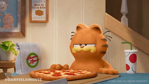 garfield is sitting at a table eating a pizza and drinking a soda