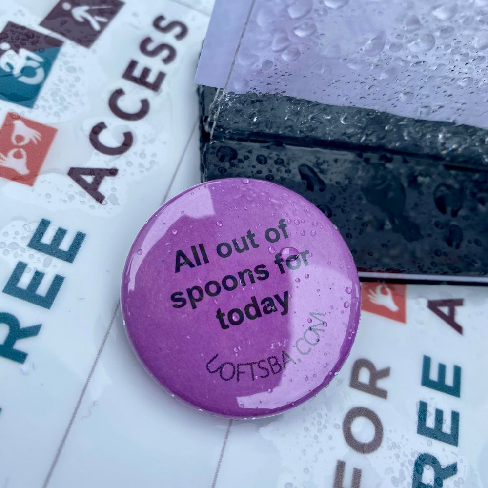 A purple button with the words "All out of spoons today" and the website uoftsba.com.