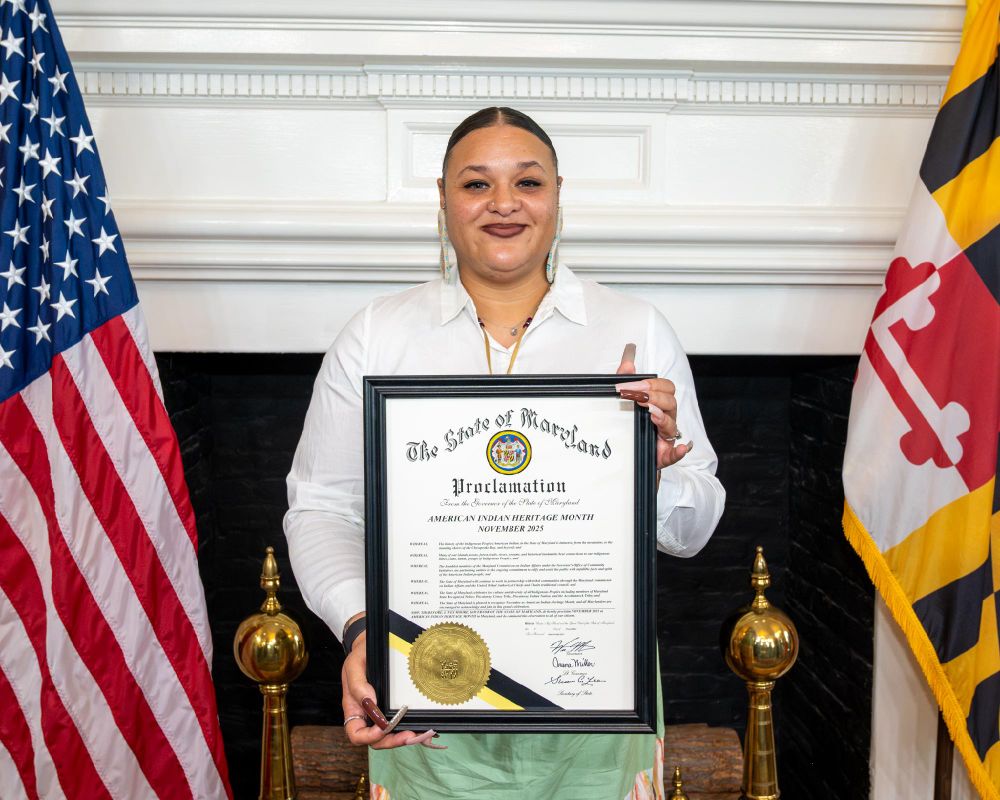 Attendees at American Indian Heritage Month Proclamation event holding proclamation 