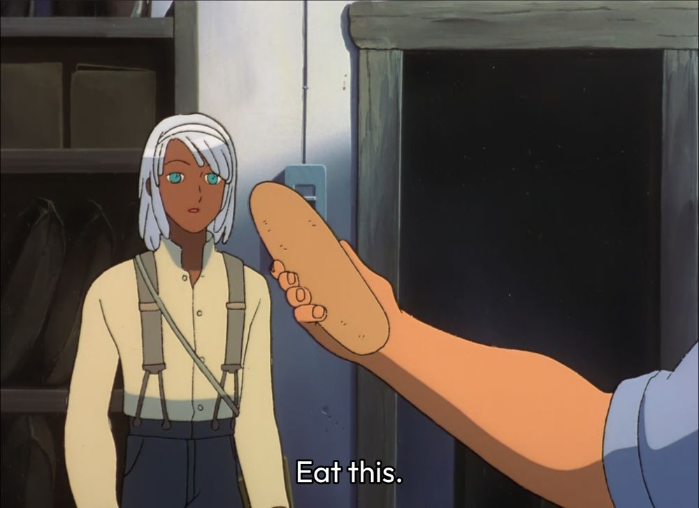 A scene from turn A gundam where Loran is being offered bread and told, "Eat this."
