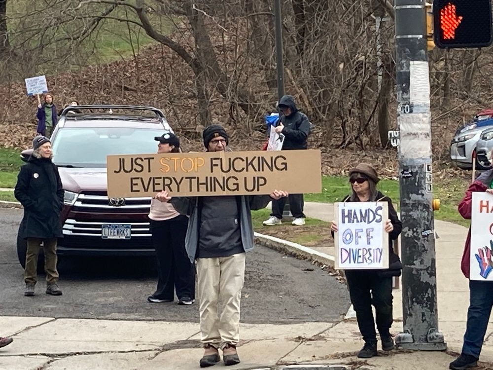 Placard that says just stop fucking everything up