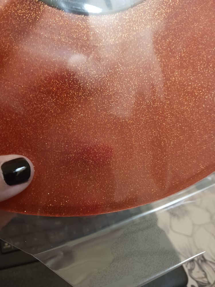 A close up of the orange glitter vinyl 