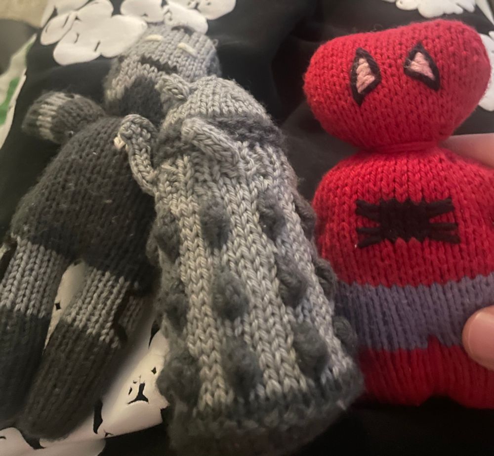 A knitted War Machine, Dalek and Spider-man.