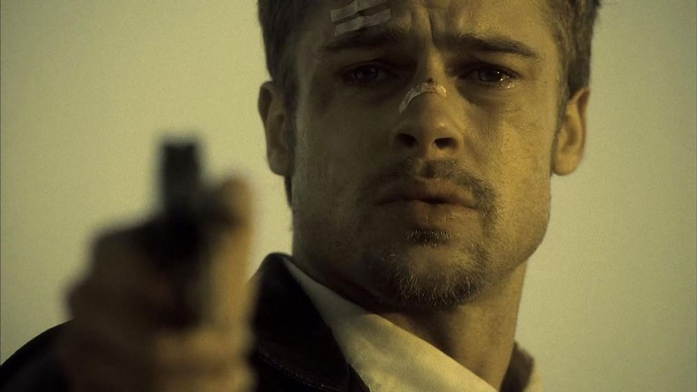 Brad Pitts is "Det. Mills" in the movie Seven. Here he is, crying and pointing a gun; about to learn what's in the box. 